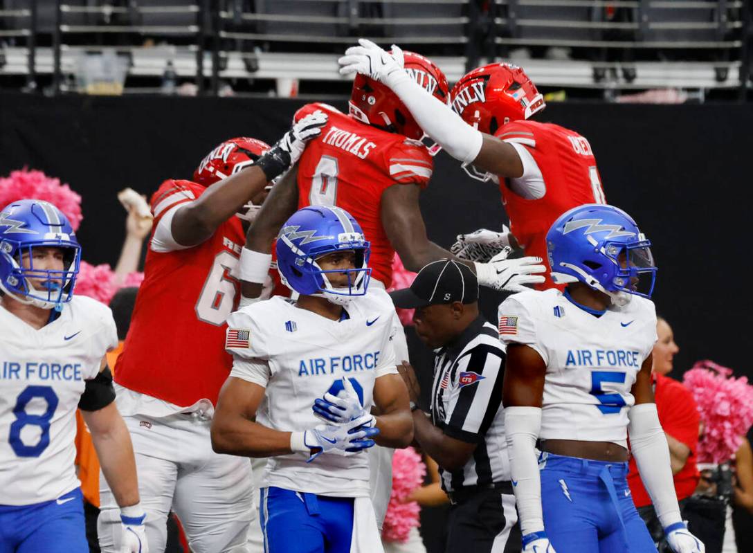 UNLV running back Jai'Den Thomas (9) celebrates his touchdown with his teammates as Air Fo ...