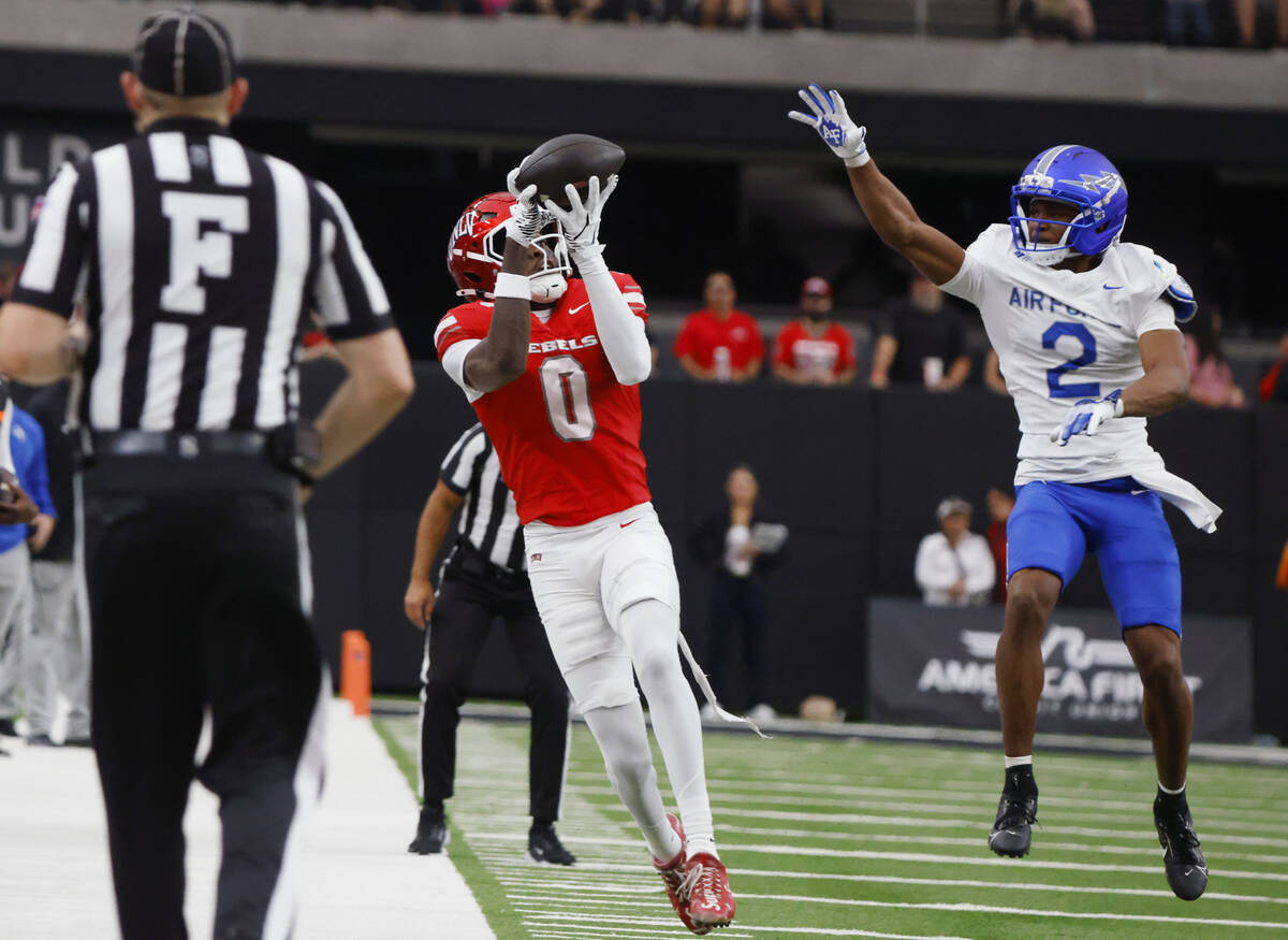 UNLV wide receiver Troy Omeire (0) catches a pass as Air Force Falcons defensive back Korey Joh ...