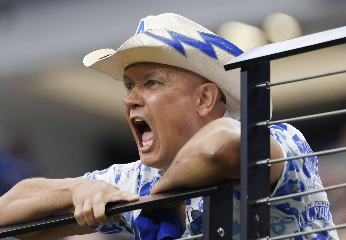 A US Air Force Falcons fan shouts as he watches his team play against UNLV during the first hal ...