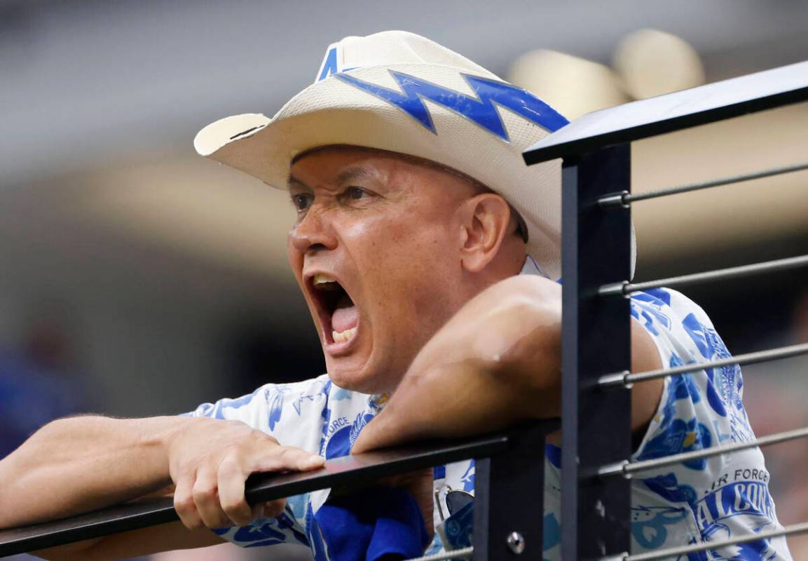 A US Air Force Falcons fan shouts as he watches his team play against UNLV during the first hal ...