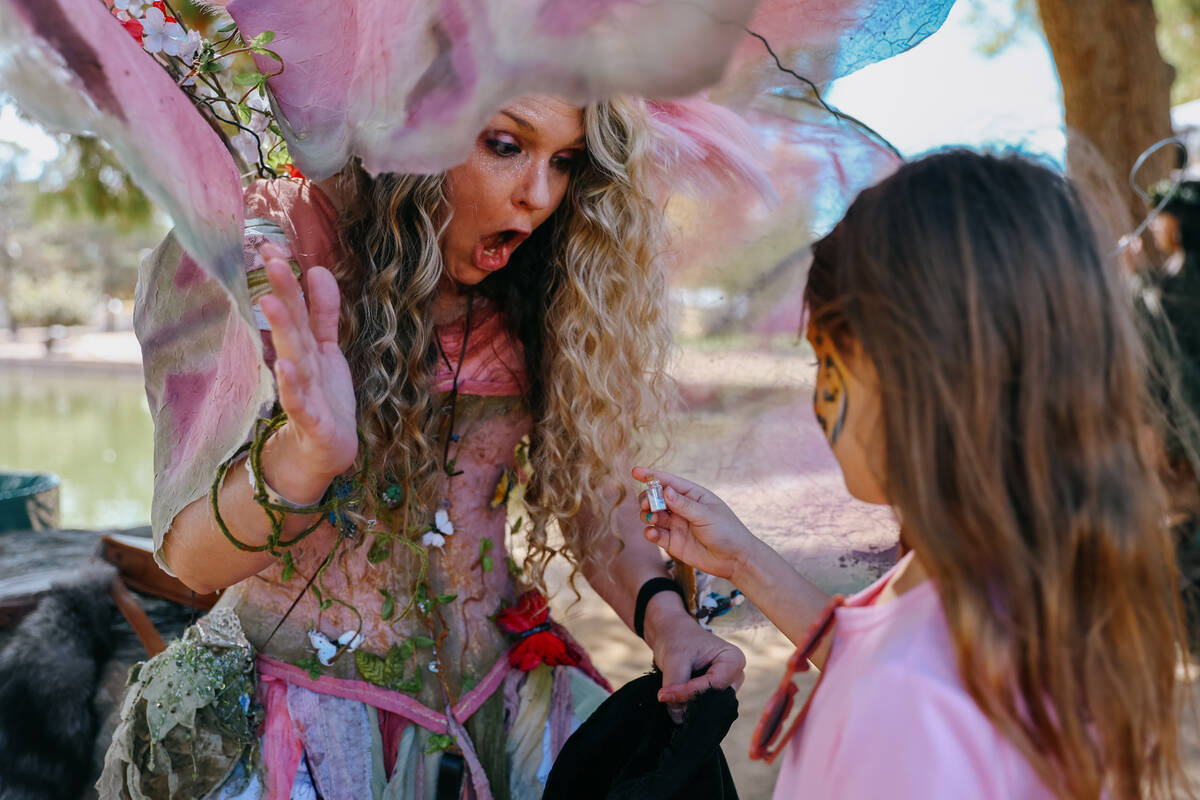 Amanda Veilleux gasps as Emma Skaggs, 7, draws a bit of fairy dust from her pouch during the 31 ...