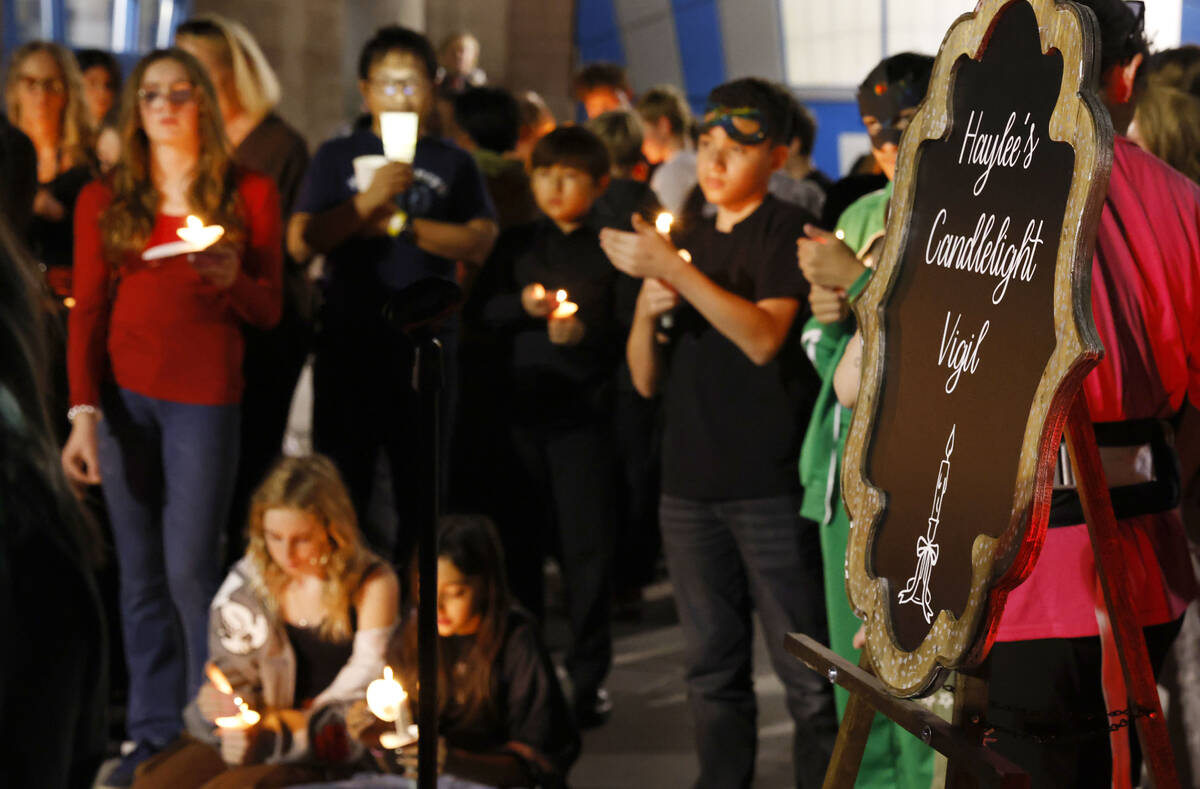 People attend a candlelight vigil for Haylee Ryan, the 12-year-old girl who was hit and killed ...