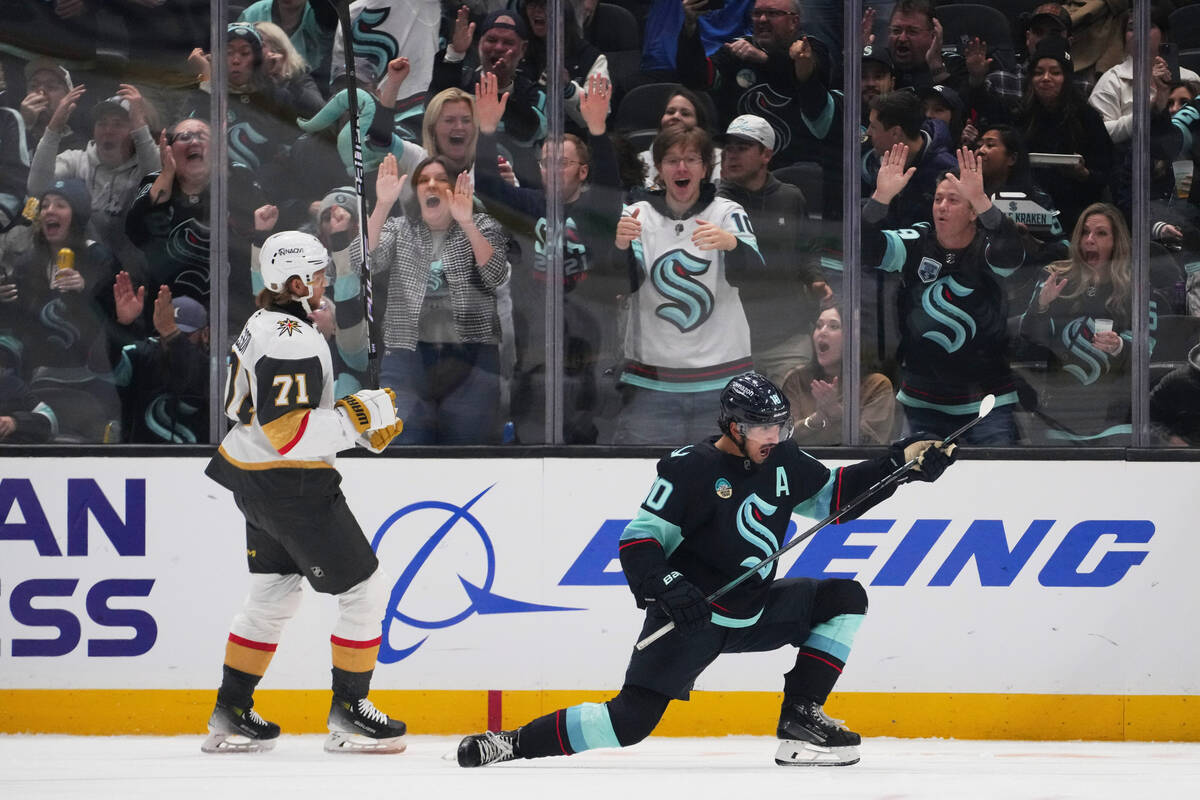 Seattle Kraken center Matty Beniers, right, celebrates scoring as Vegas Golden Knights center W ...