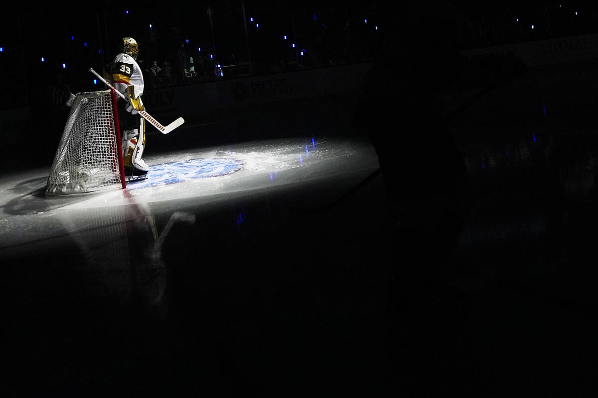 A spotlight shines on Vegas Golden Knights goaltender Adin Hill before an NHL hockey game again ...