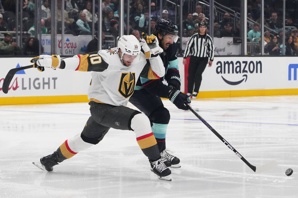 Vegas Golden Knights center Colton Sissons (10) vies for the puck against Seattle Kraken center ...