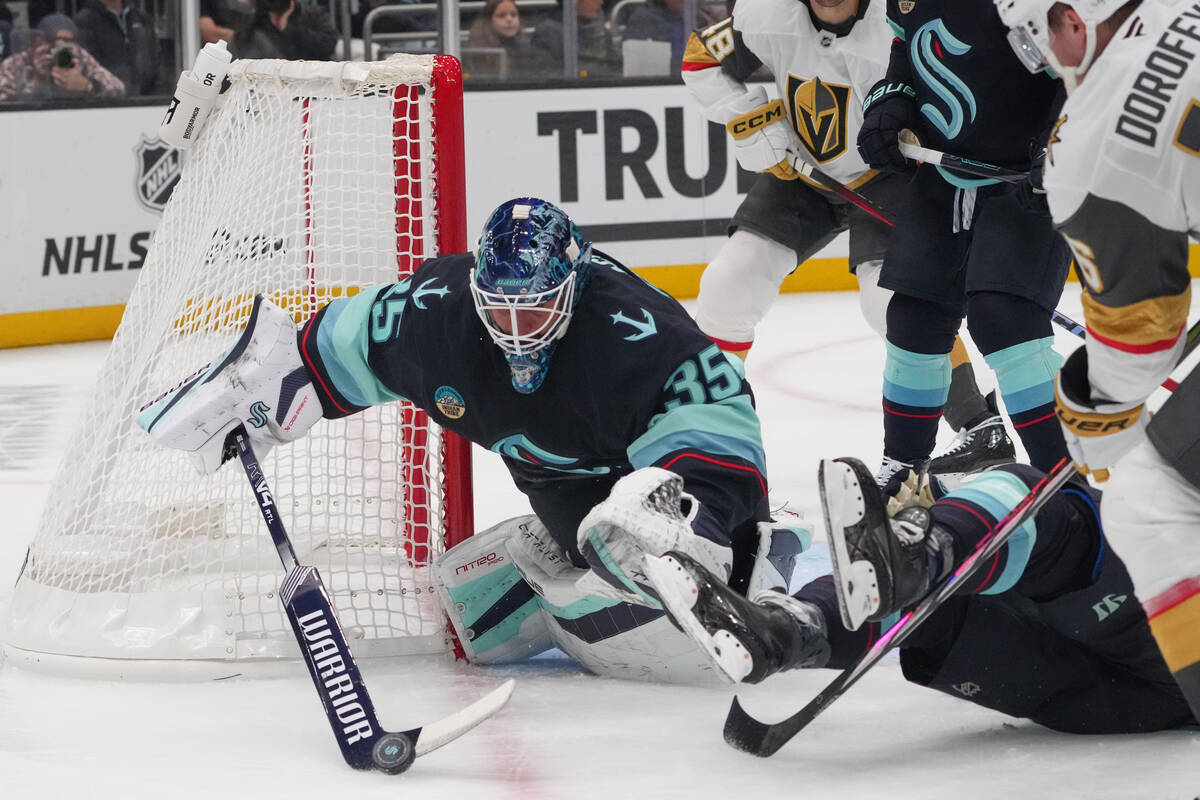 Seattle Kraken goaltender Joey Daccord makes a save against Vegas Golden Knights right wing Pav ...