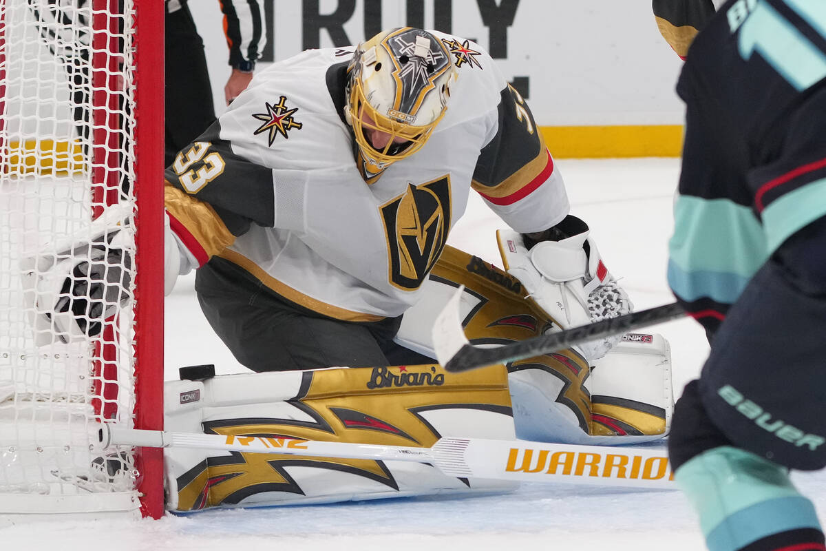 Vegas Golden Knights goaltender Adin Hill stops the puck on his pads against the Seattle Kraken ...