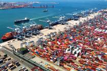 FILE - An aerial view of a container port is seen in Qingdao in east China's Shandong prov ...