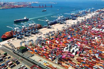 FILE - An aerial view of a container port is seen in Qingdao in east China's Shandong prov ...