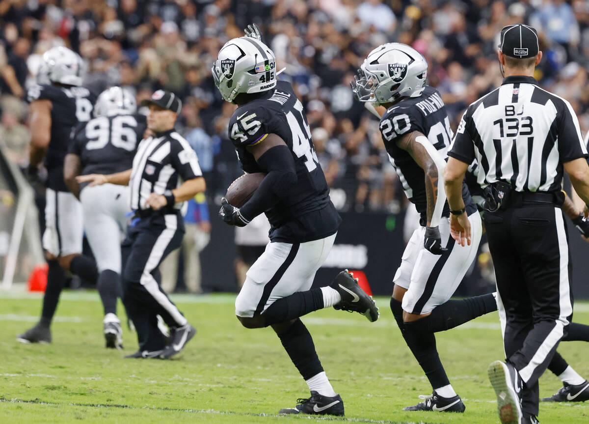 Raiders linebacker Devin White (45) celebrates after intercepting a pass during the first half ...