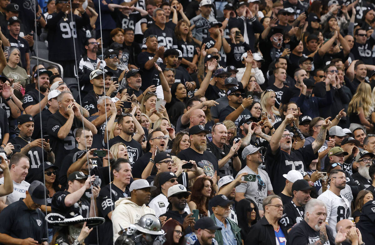 Raiders fans cheer for their team as they watch an NFL game against Tennessee Titans at Allegia ...