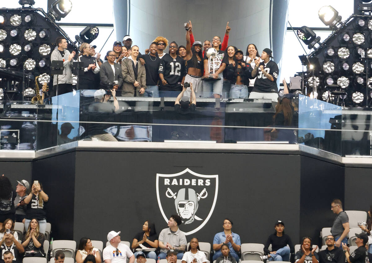 The Las Vegas Aces players acknowlege the crowd before liting the Al Davis Memorial Torch befor ...