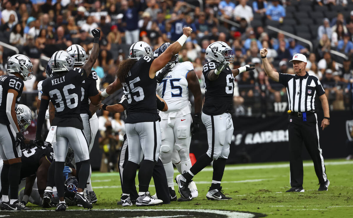 Raiders defensive tackle Adam Butler (69) celebrates after the team sacked Tennessee Titans qua ...