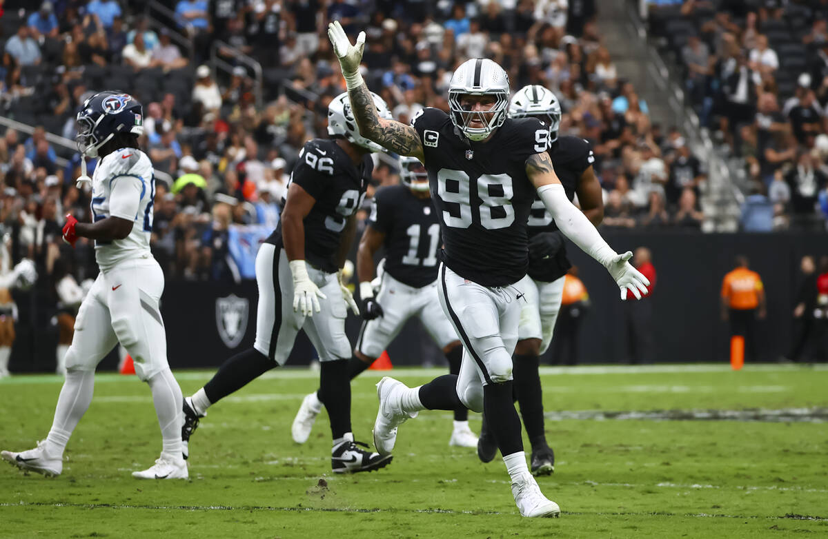 Raiders defensive end Maxx Crosby (98) celebrates after the team sacked Tennessee Titans quarte ...