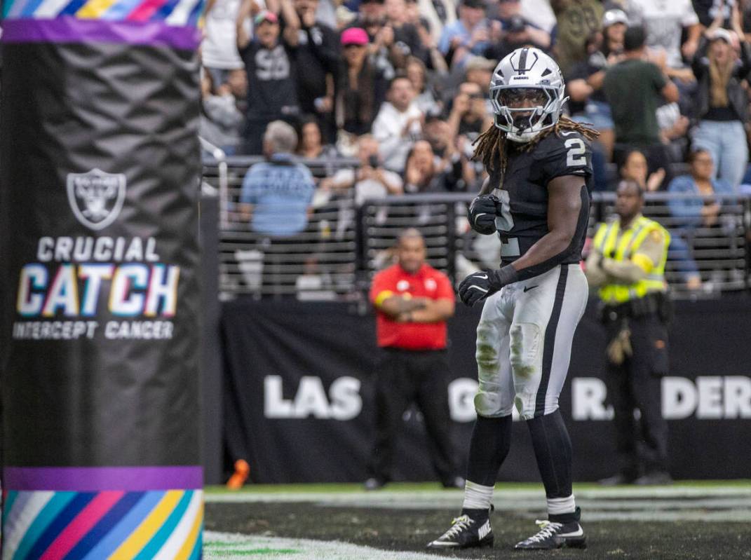 Raiders running back Ashton Jeanty (2) jumps after scoring a touchdown during the second half o ...