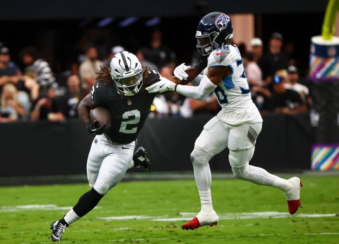 Raiders running back Ashton Jeanty (2) runs the ball against Tennessee Titans cornerback L&#039 ...