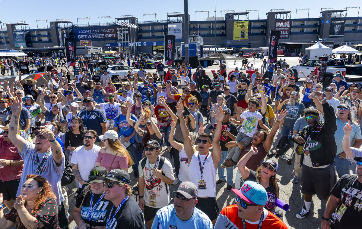 Fans are excited for driver Denny Hamlin (11) interviewed at the Toyota installation in the Fan ...
