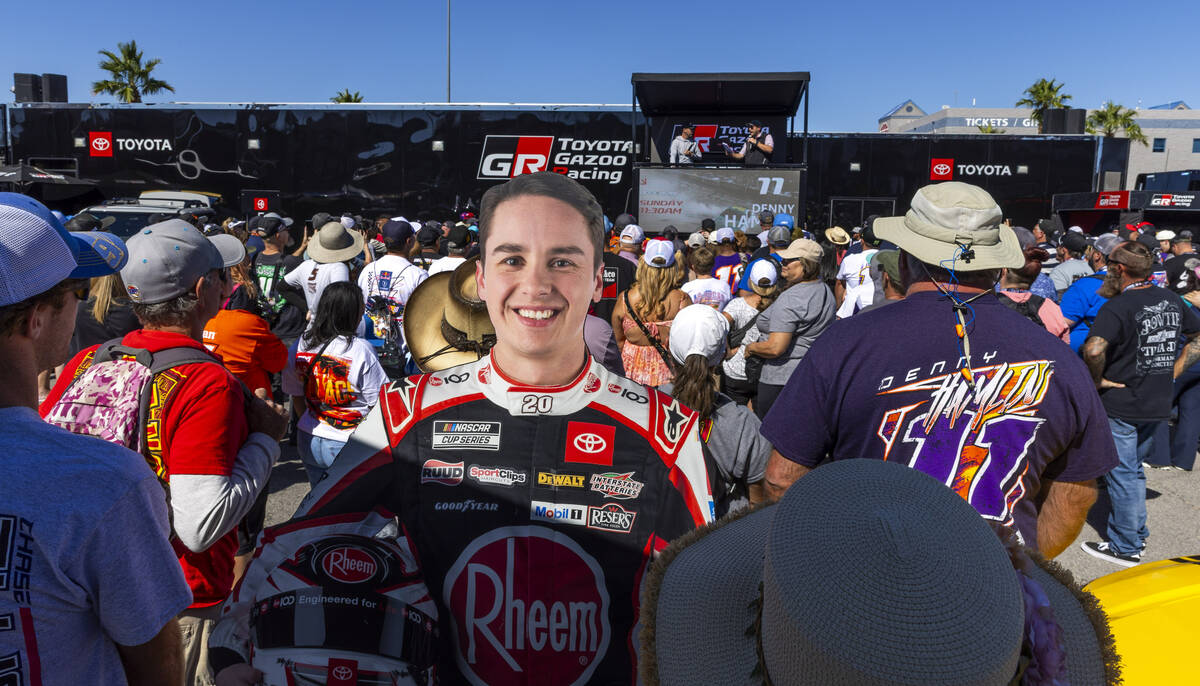 A cutout of Christopher Bell (20) is on hand as Denny Hamlin (11) is interviewed at the Toyota ...