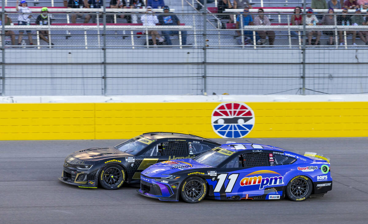 Denny Hamlin (11) battles with Kyle Larson (5) late in the race during the NASCAR Cup Series So ...