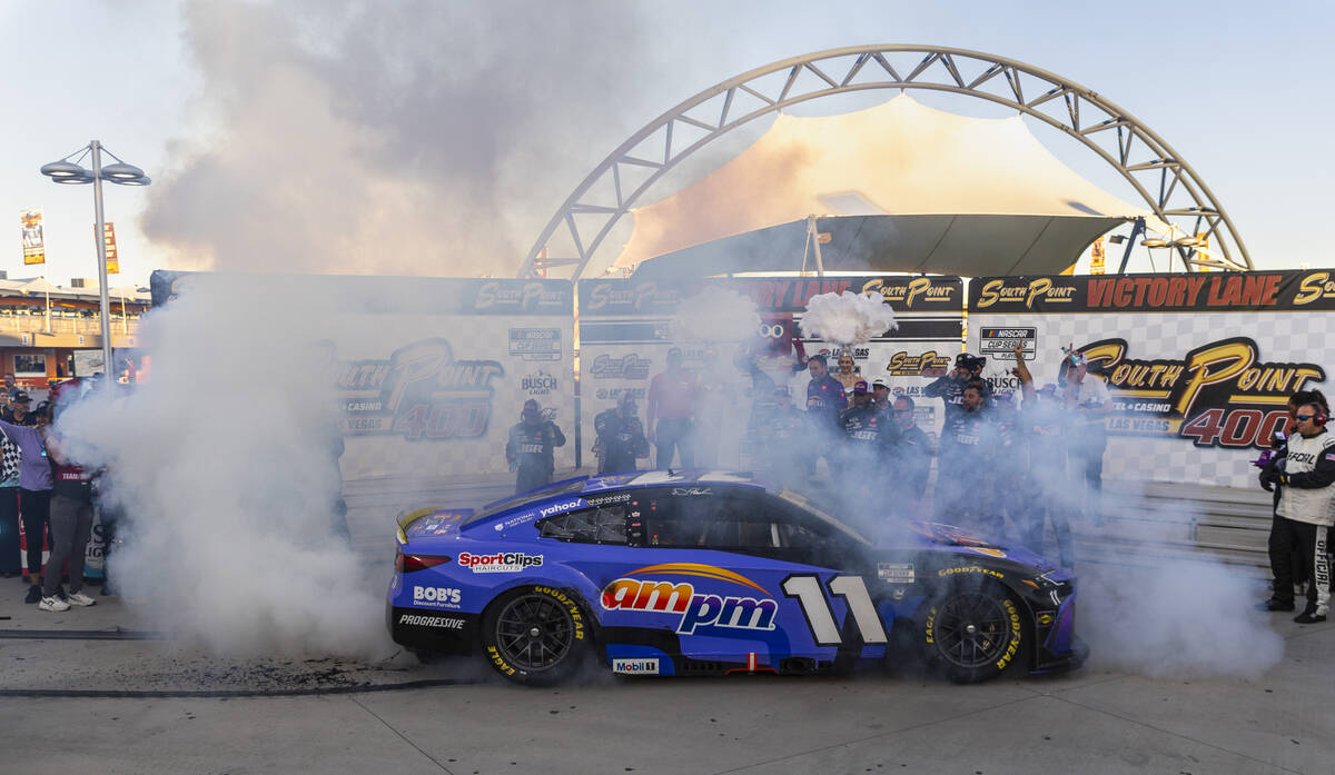 Denny Hamlin (11) does a burn out in victory lane after winning the NASCAR Cup Series South Poi ...
