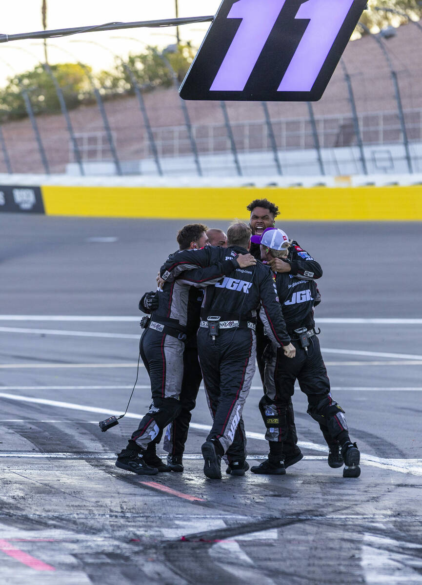 The pit crew for Denny Hamlin (11) celebrate his win in the NASCAR Cup Series South Point 400 r ...