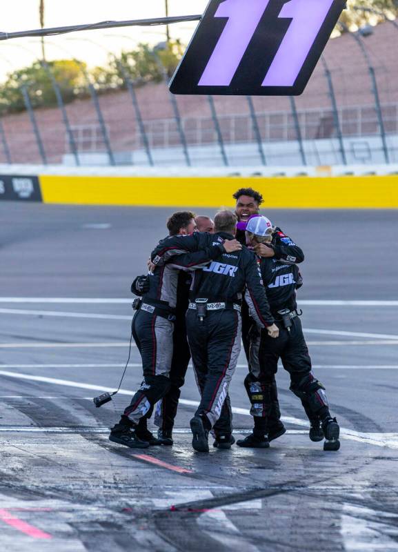 The pit crew for Denny Hamlin (11) celebrate his win in the NASCAR Cup Series South Point 400 r ...