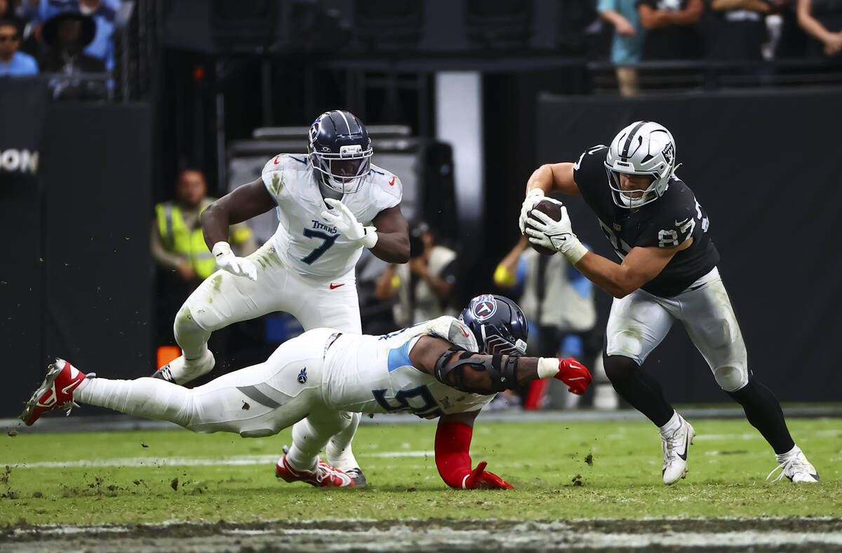 Raiders tight end Michael Mayer (87) runs past Tennessee Titans defensive tackle Jeffery Simmon ...