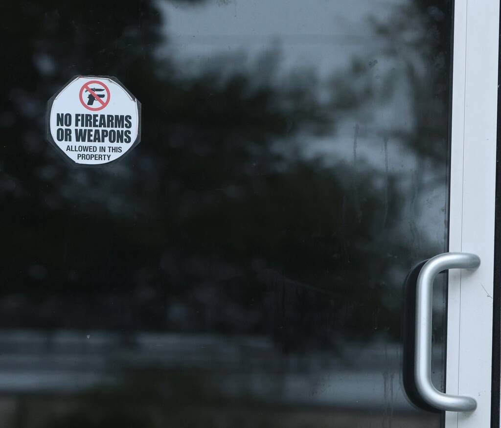 A sticker on the door of Willie's Bar and Grill in St Helena Island, S.C. after a shooting ...