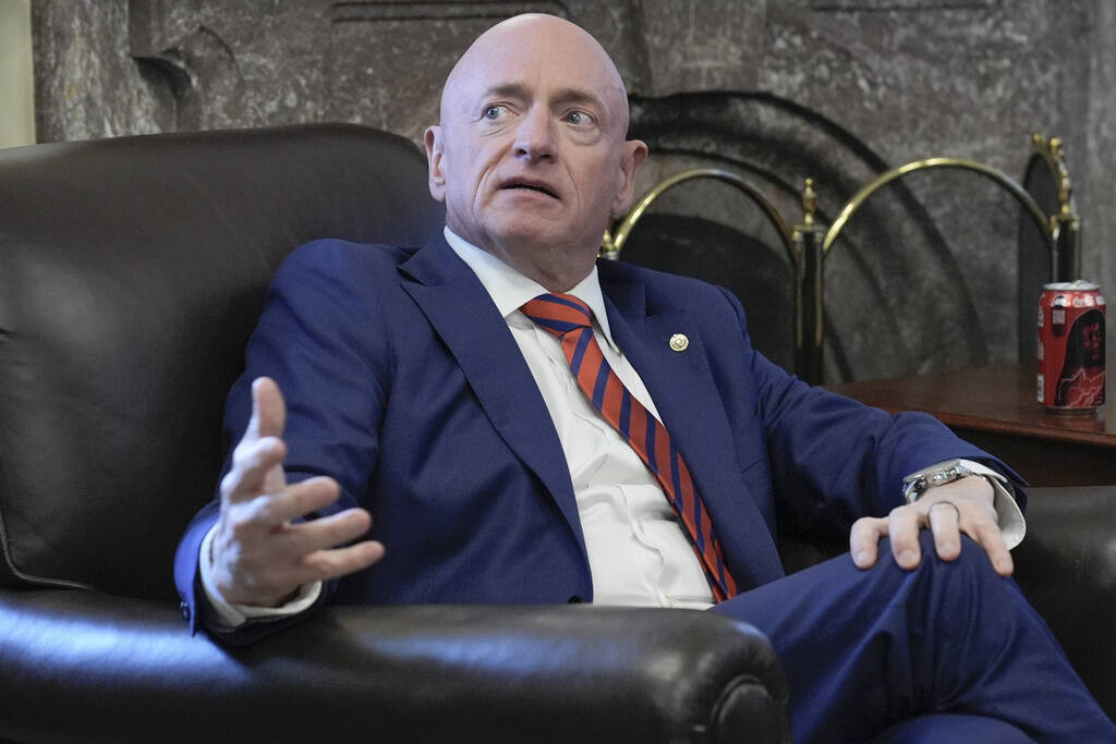 Sen. Mark Kelly, D-Ariz., speaks to reporters on AI during a news conference at the Capitol Hil ...