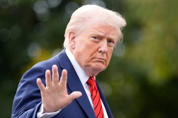 President Donald Trump walks on the South Lawn after arriving on Marine One at the White House, ...