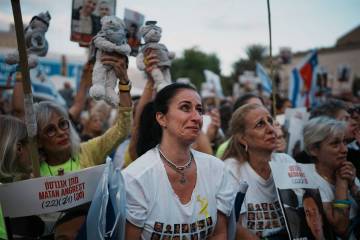 People gather at a plaza known as the hostages square in Tel Aviv, Israel, Monday, Oct. 13, 202 ...