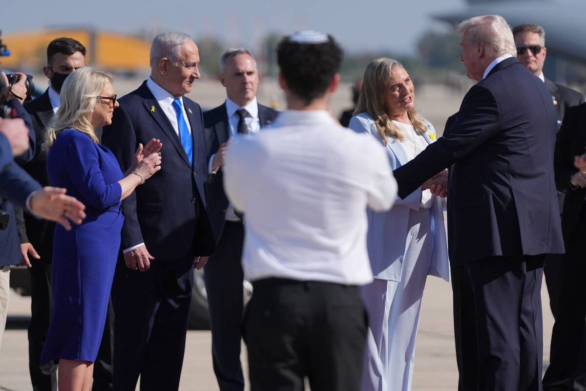 President Donald Trump greets Michal Herzog as Israel's Prime Minister Benjamin Netanyahu ...