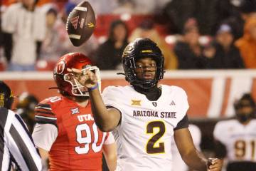 Arizona State quarterback Jeff Sims tosses the ball to the ref during an NCAA college football ...