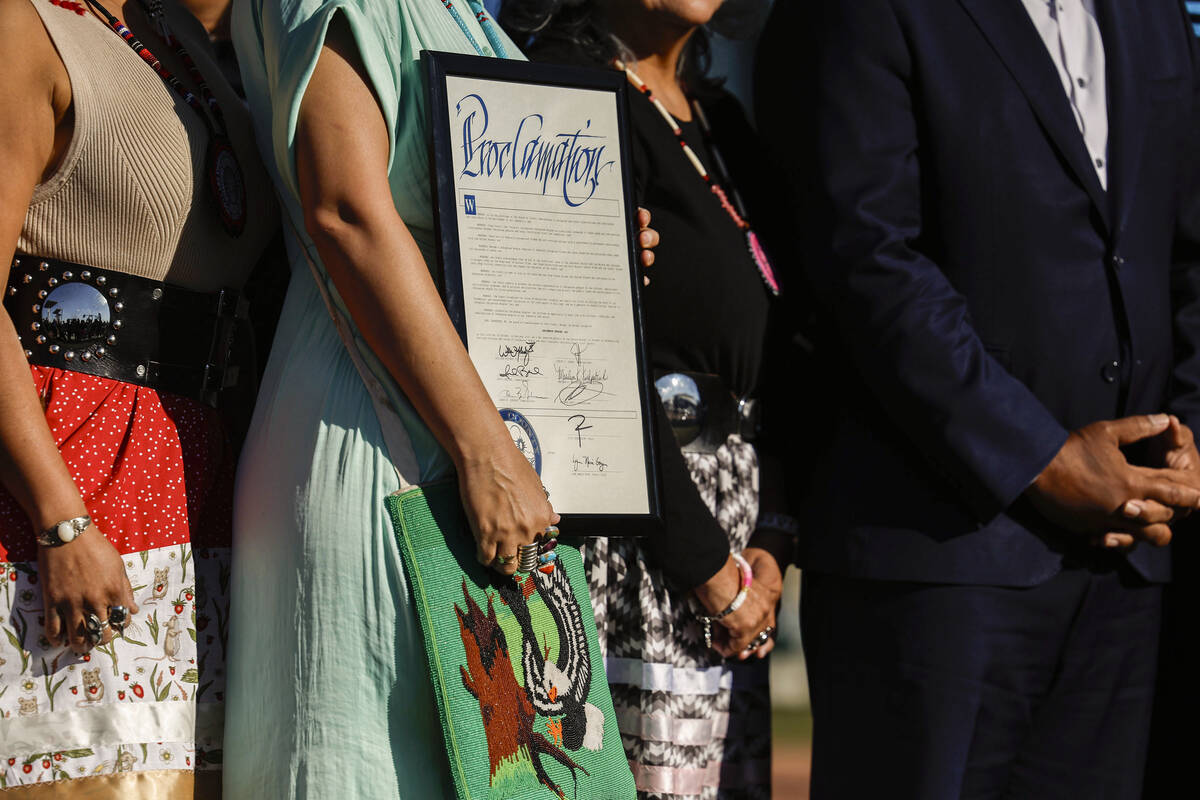 Members of the Native Voters Alliance Nevada, tribal leaders and community members take a photo ...