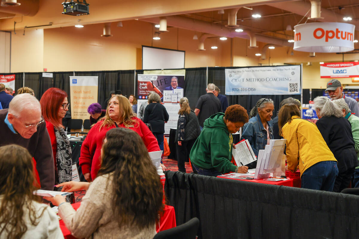 People visit booths of various vendors at The Aging Wellness Expo, powered by the Las Vegas Rev ...