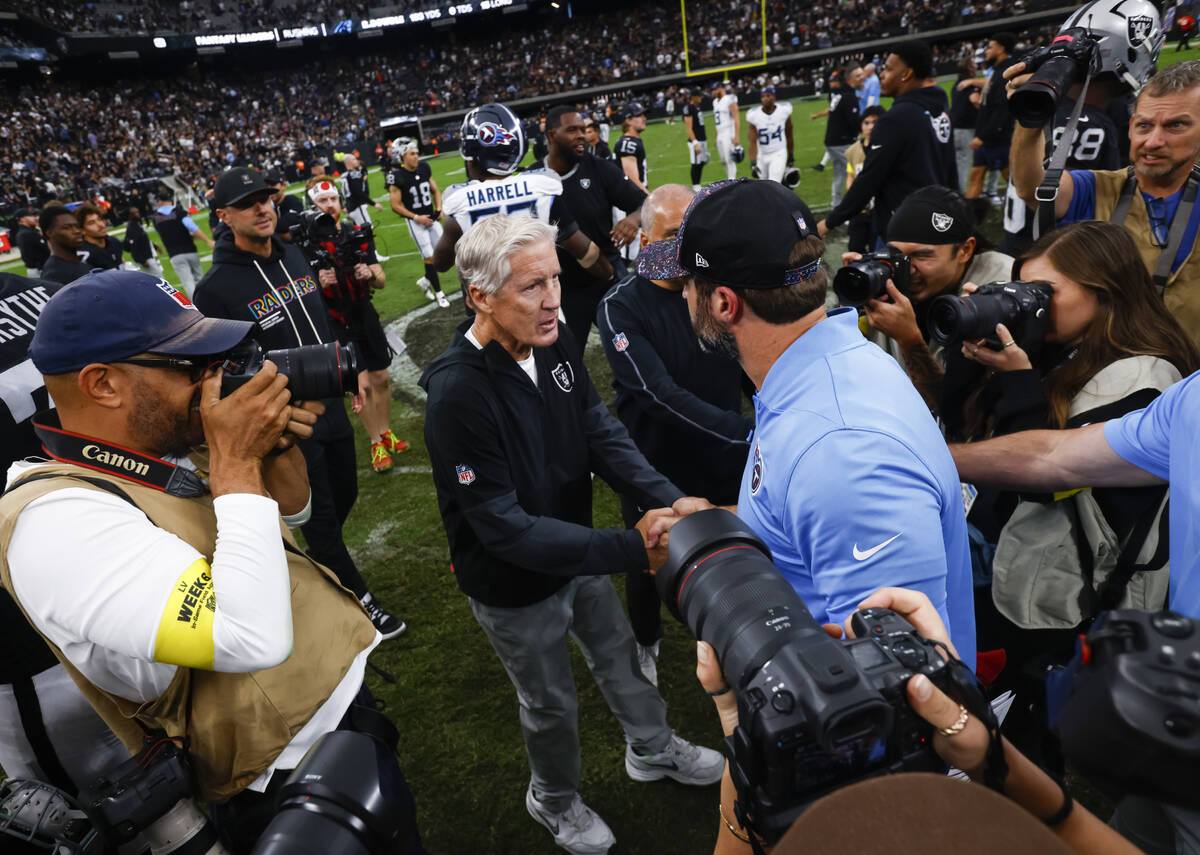 Raiders head coach Pete Carroll greets Tennessee Titans head coach Brian Callahan after their N ...