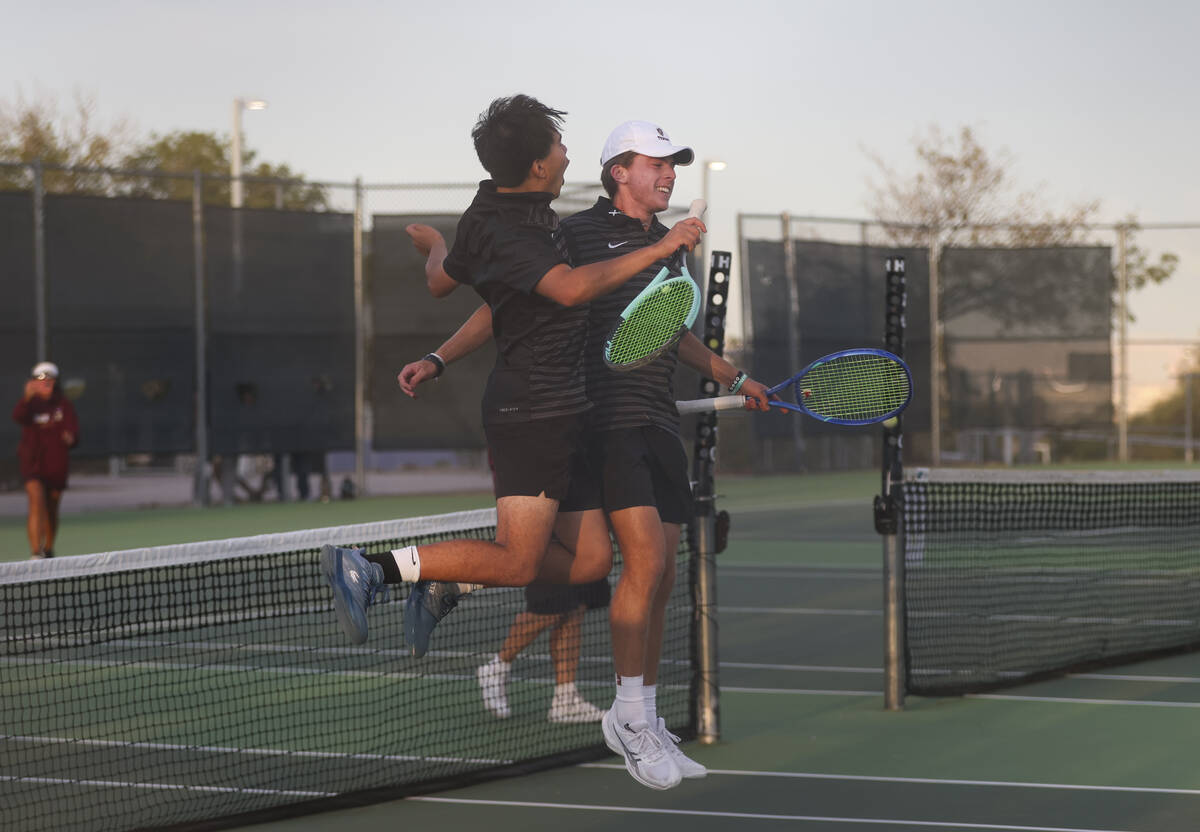 Faith Lutheran’s Davey Gluth, right, and Paul Williams celebrate after defeating Palo Ve ...