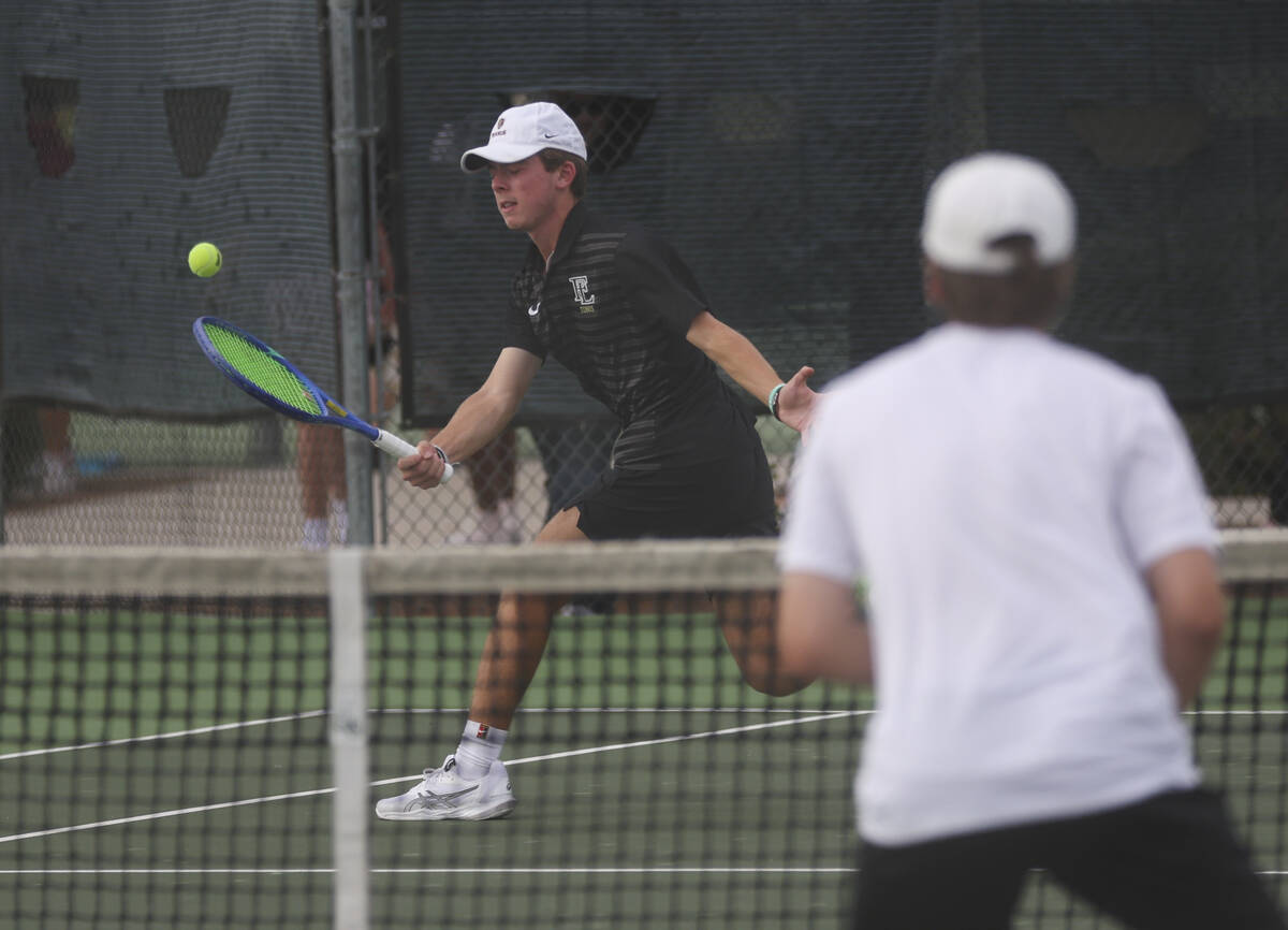Faith Lutheran’s Davey Gluth competes in doubles against Palo Verde for the 5A boys tenn ...