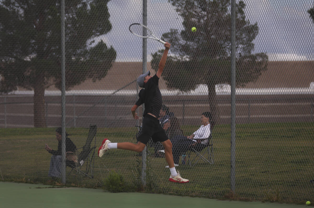 Faith Lutheran’s Huxley Banks competes in doubles against Palo Verde for the 5A boys ten ...