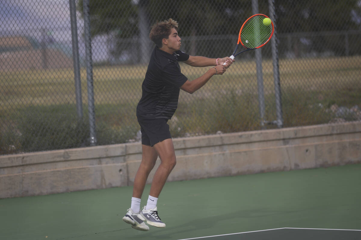 Faith Lutheran’s Beckham Butler competes against Palo Verde for the 5A boys tennis team ...