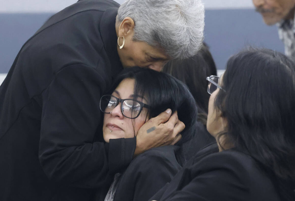 Josephine Tienda, center, the mother of a 2-year-old Nicolas Rodriguez-Tienda, is comforted by ...