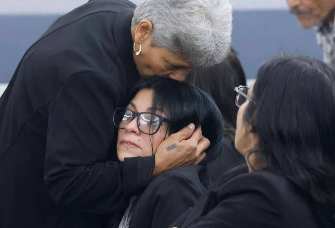 Josephine Tienda, center, the mother of a 2-year-old Nicolas Rodriguez-Tienda, is comforted by ...