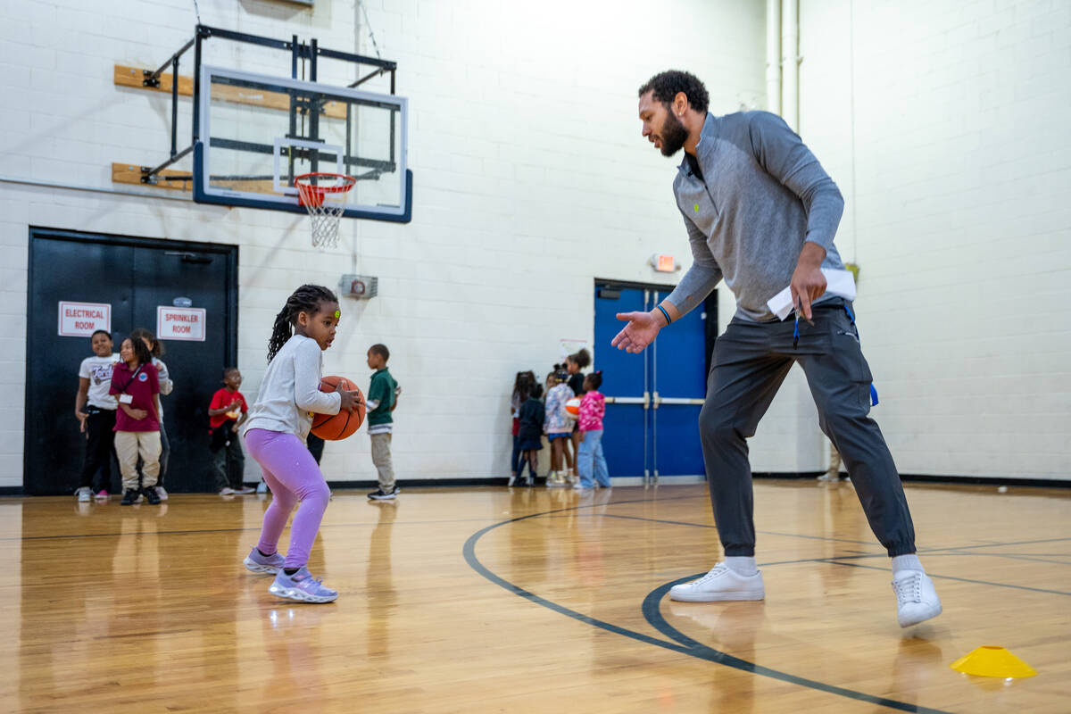 Former college basketball player Antanee Pinkard coaches Rielle Zara, 5, inside the gym at the ...