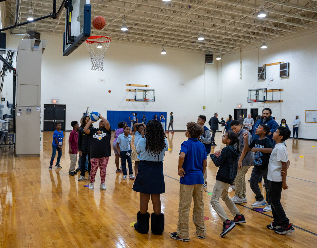 A group participates in basketball drills inside the gym at the Andre Agassi Clubhouse in Las V ...