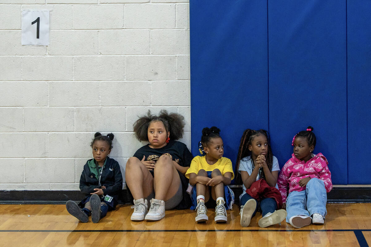 A group takes a break from basketball drills inside the gym at the Andre Agassi Clubhouse in La ...