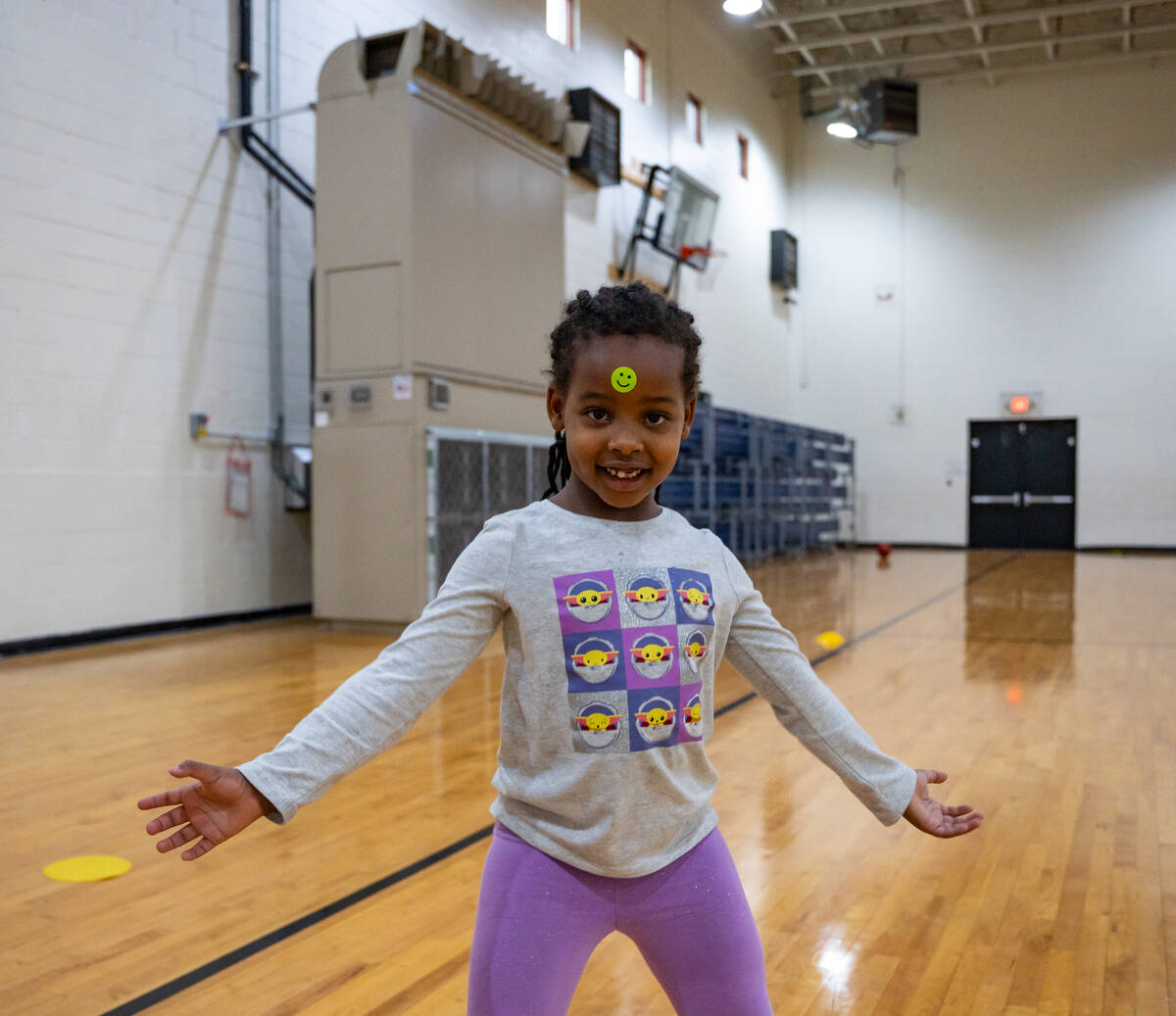 Rielle Zara, 5, dances in front of a newly installed ultra-efficient air rotation cooling unit ...