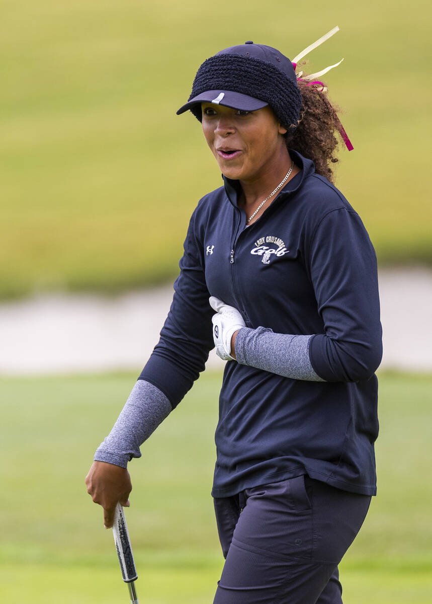 Faith Lutheran's Macy Garth is pleased with a long putt during the 5A girls golf state tou ...