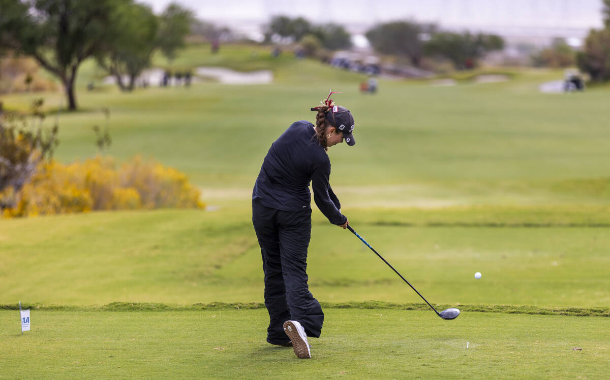 Faith Lutheran's Madison Perez drives off the tee during the 5A girls golf state tournamen ...