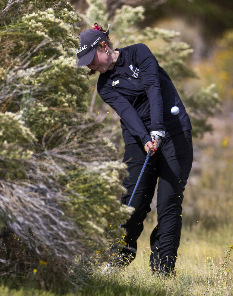 Faith Lutheran's Madison Perez chips out of the weeds during the 5A girls golf state tourn ...