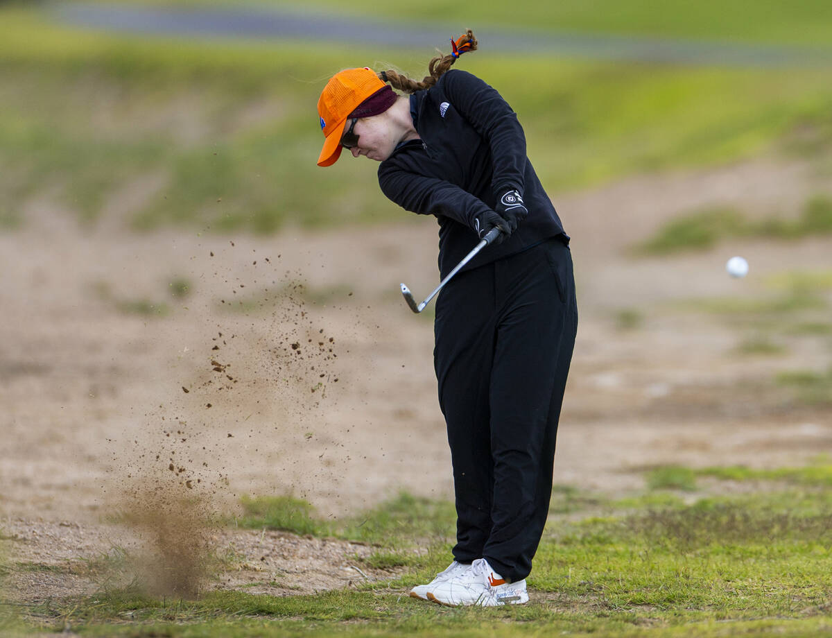 Bishop Gorman's Samantha Harris chips out of the dirt during the 5A girls golf state tourn ...